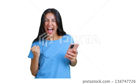 Woman celebrating good news holding smartphone screaming Woman celebrating good news holding smartphone screaming 138747726