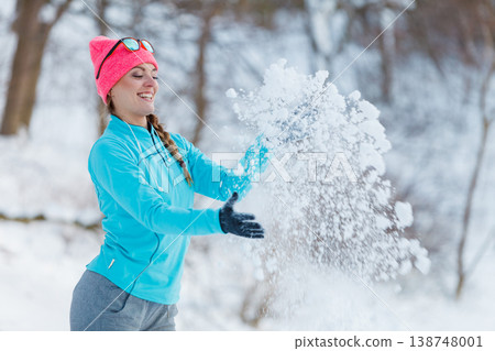 Girl relaxing in winter park. Girl relaxing in winter park. 138748001