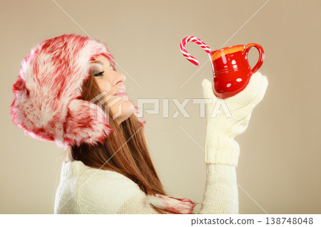 Girl with cane in xmas mug. Girl with cane in xmas mug. 138748048