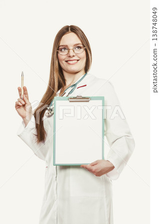 Woman doctor with stethoscope, clipboard and pen. Woman doctor with stethoscope, clipboard and pen. 138748049