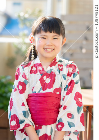 A girl in a yukata with face paint 138748121