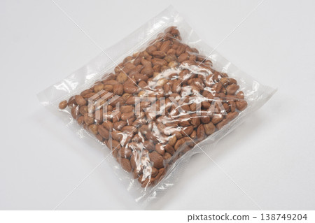 Vacuum packed hazelnuts on white background Vacuum packed hazelnuts on white background 138749204