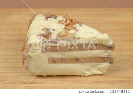 Processed Cheese Cake with Walnuts on Board Processed Cheese Cake with Walnuts on Board 138749212