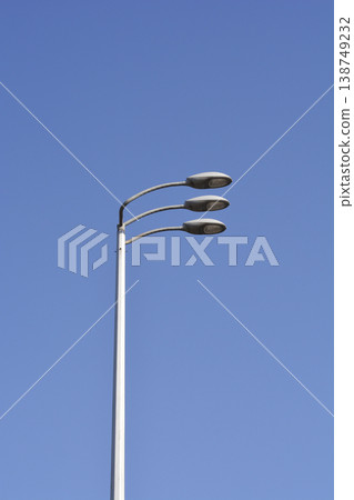 Modern Triple Street Lamp Against Blue Sky Modern Triple Street Lamp Against Blue Sky 138749232