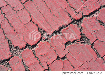 Cracked Red Paint Texture on Ground 138749234