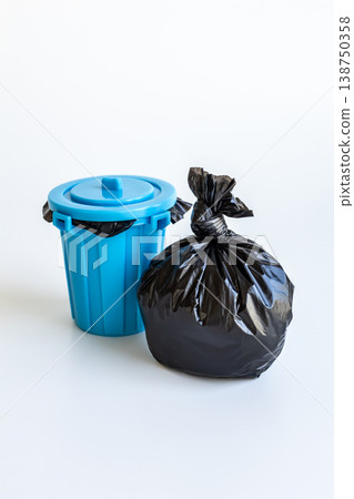 Garbage bags and trash cans on a white background 138750358