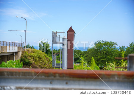 Ocean view over the guardrail 138750448