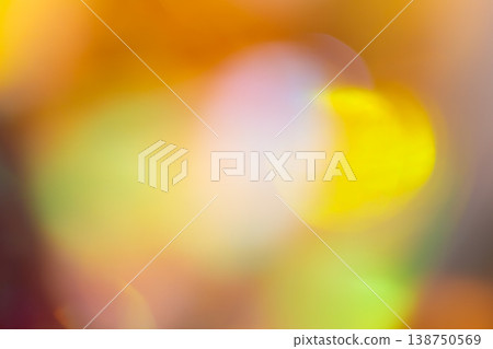 Warm yellow and orange abstract bokeh background with glowing light circles on blurred backdrop Warm yellow and orange abstract bokeh background with glowing light circles on blurred backdrop 138750569