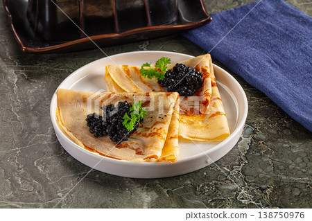 luxury pancake with black caviar 138750976