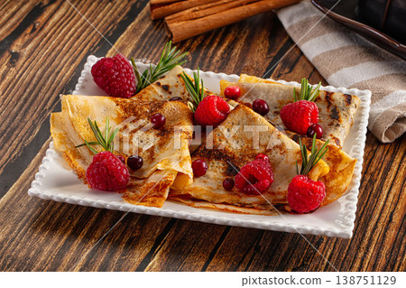 Sweet homemade pancakes with raspberry Sweet homemade pancakes with raspberry 138751129