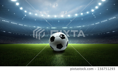 Football ball on the pitch with stadium lights at night. Football ball on the pitch with stadium lights at night. 138751293