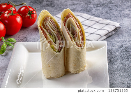 Wrap roll tortilla with ham and cheese Wrap roll tortilla with ham and cheese 138751365