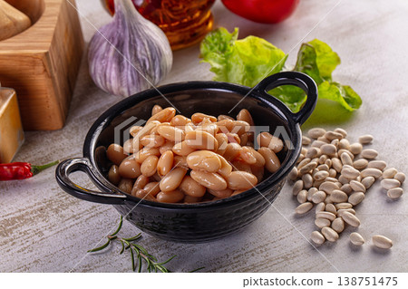 Rustic still life of cooked cannellini beans with fresh vegetables and spices Rustic still life of cooked cannellini beans with fresh vegetables and spices 138751475