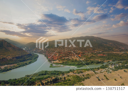 Georgia. Aerial view of Mtzkheta. Old city, river and sky with clouds Georgia. Aerial view of Mtzkheta. Old city, river and sky with clouds 138751517
