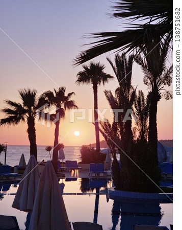 Sea beach sunset light with coconut palm tree againt blue sky summer vacation background Sea beach sunset light with coconut palm tree againt blue sky summer vacation background 138751682