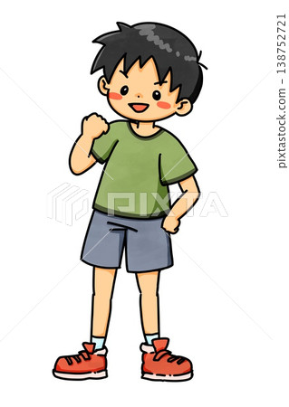 A spirited elementary school boy in a green T-shirt makes a victory pose. 138752721