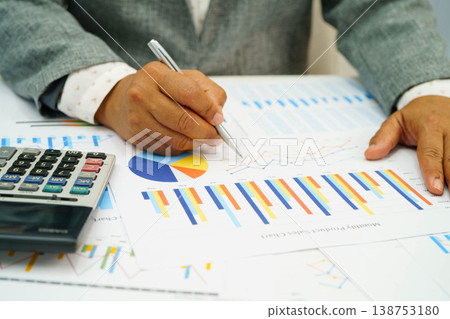 Asian business woman working with financial graph. 138753180