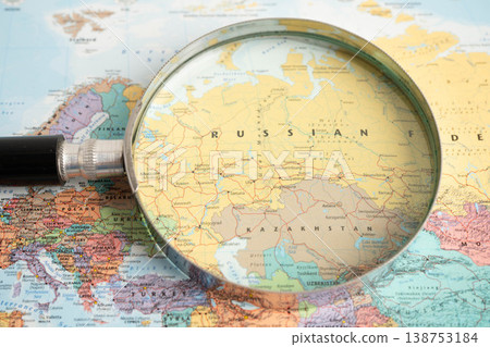 Bangkok, Thailand May 15, 2022 Magnifying glass on world map. Bangkok, Thailand May 15, 2022 Magnifying glass on world map. 138753184