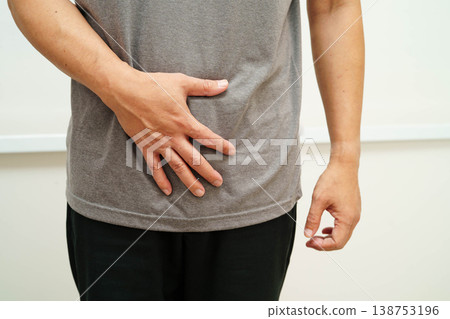 Hernia, Asian man stomach ache, abdominal pain and urology problem health. 138753196
