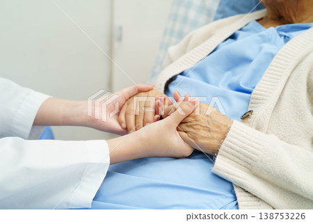 Asian doctor checking and treat elderly woman patient health in hospital. Asian doctor checking and treat elderly woman patient health in hospital. 138753226