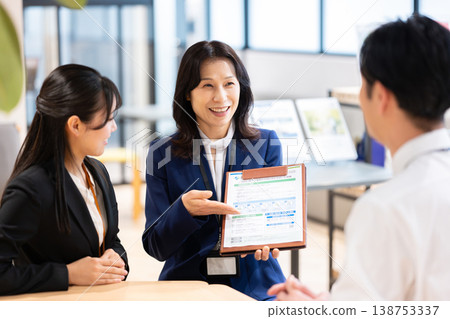 A businesswoman explaining the contract details. 138753337