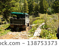 Off road trip in GAZ 66 climbing to Karakol lake in sunny summer day. Heavy powerful truck terrain vehicle with wheels. Old Military car now a touristic transport. Republic Gorny Altai, Russia. Asia 138753373