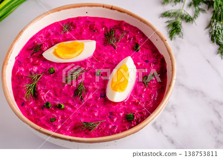 Cold summer soup of beets, yogurt, cucumbers, eggs and dill. 138753811