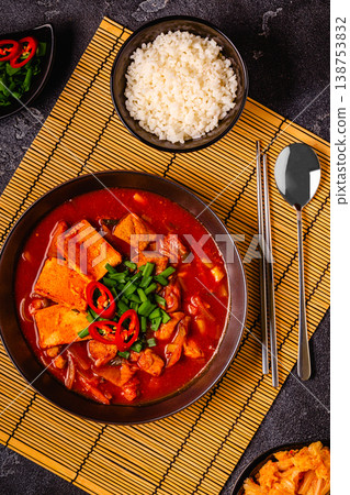 Korean traditional food, spicy kimchi soup (kimchi tige) with pork and tofu cheese. Korean traditional food, spicy kimchi soup (kimchi tige) with pork and tofu cheese. 138753832