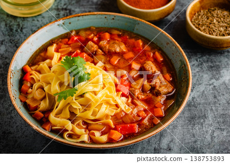 Lagman soup with lamb, homemade noodles and vegetables. Lagman soup with lamb, homemade noodles and vegetables. 138753893