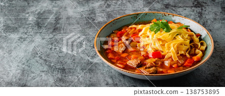 Lagman soup with lamb, homemade noodles and vegetables. Lagman soup with lamb, homemade noodles and vegetables. 138753895