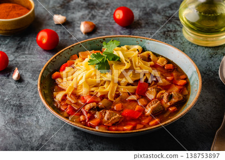 Lagman soup with lamb, homemade noodles and vegetables. 138753897