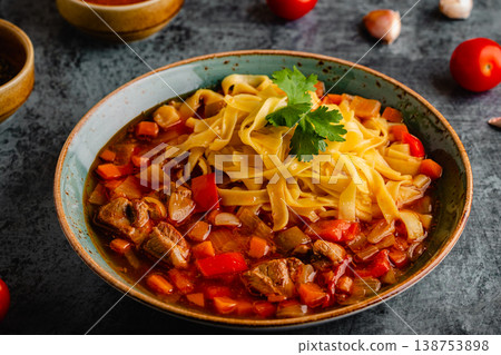 Lagman soup with lamb, homemade noodles and vegetables. 138753898