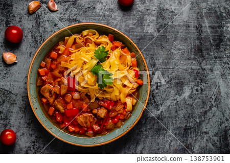 Lagman soup with lamb, homemade noodles and vegetables. 138753901