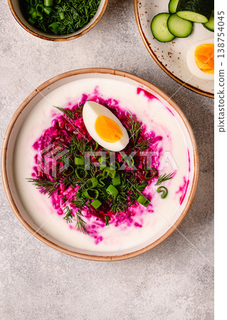 Cold summer soup of beets, kefir, cucumbers, eggs and dill. 138754045