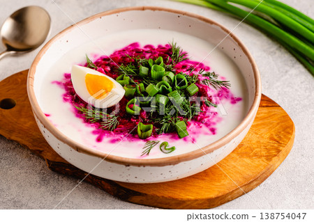 Cold summer soup of beets, kefir, cucumbers, eggs and dill. 138754047
