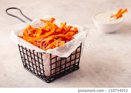 Sweet potato fries with blue cheese sauce. Sweet potato fries with blue cheese sauce. 138754052