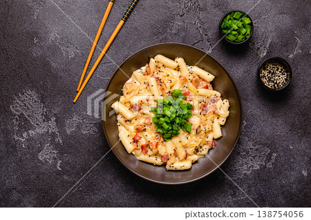 Spicy Rice Cake with Cheese and Bacon or Cream Teokbokki, Tteokbokki. Spicy Rice Cake with Cheese and Bacon or Cream Teokbokki, Tteokbokki. 138754056