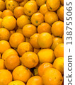 Fresh oranges piled together in a vibrant display at a market, showcasing their bright color and natural texture 138755065