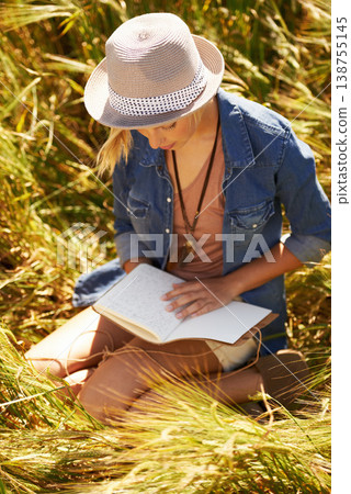 Nature field, book and woman reading diary entry about spring wellness, stress relief or creative story in countryside. Notebook, planner and person check journal notes, information or. travel letter 138755145
