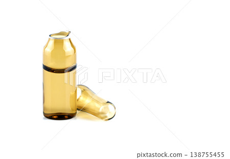 Macro of a snapped open medical vial with separated glass top on a clean white surface Macro of a snapped open medical vial with separated glass top on a clean white surface 138755455
