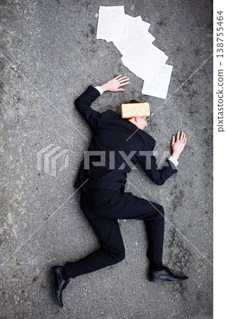 Death, accident and brick on a business man lying on a street in the city from above for financial crisis. Ground, documents and mistake with a young employee crippled by debt in a recession Death, accident and brick on a business man lying on a street in the city from above for financial crisis. Ground, documents and mistake with a young employee crippled by debt in a recession 138755464