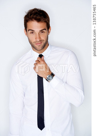 Portrait, fashion and a business man getting ready for corporate work in studio on a white background. Face, shirt and tie with a confident young employee dressing in a professional clothes outfit Portrait, fashion and a business man getting ready for corporate work in studio on a white background. Face, shirt and tie with a confident young employee dressing in a professional clothes outfit 138755465