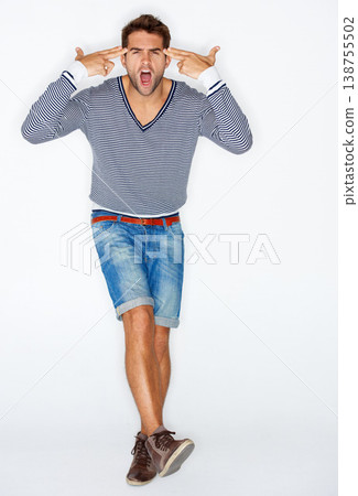 Portrait, crazy and finger gun with a man in studio isolated on a white background for attitude and expression Fashion, anger and a young model pointing to his temple to gesture a mind blown emoji Portrait, crazy and finger gun with a man in studio isolated on a white background for attitude and expression Fashion, anger and a young model pointing to his temple to gesture a mind blown emoji 138755502
