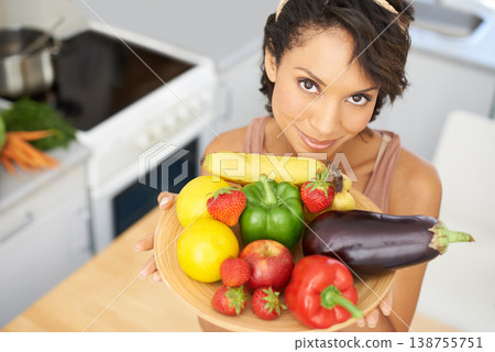 Portrait, health and vegetables with a woman in the kitchen of her home for nutrition, diet or meal preparation. Face, ingredients and a recipe for cooking food with a young person in her apartment Portrait, health and vegetables with a woman in the kitchen of her home for nutrition, diet or meal preparation. Face, ingredients and a recipe for cooking food with a young person in her apartment 138755751