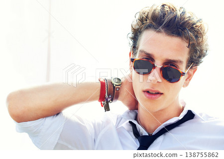 Portrait of man with cool fashion, sunglasses and confidence on white background with attractive young person. Modern professional style, rebel attitude and face of handsome male model on cloudy sky. Portrait of man with cool fashion, sunglasses and confidence on white background with attractive young person. Modern professional style, rebel attitude and face of handsome male model on cloudy sky. 138755862