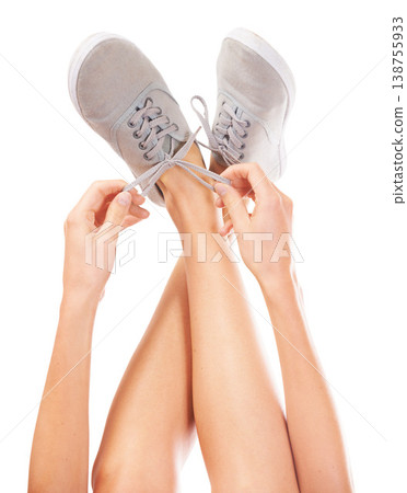 Sneakers, white background and person tie shoes for fashion, trendy style and designer in studio. Footwear, legs and hands tying shoelace on feet isolated for walking, running and hiking or sports Sneakers, white background and person tie shoes for fashion, trendy style and designer in studio. Footwear, legs and hands tying shoelace on feet isolated for walking, running and hiking or sports 138755933