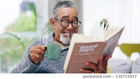 Elderly man, book and coffee on sofa with smile, reading or relax in retirement in home living room. Senior african person, literature and happy with tea for knowledge, thinking and drink on couch 138755937