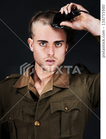 Military, soldier and portrait of man in haircut at studio isolated on a black background. Army, serious face and person shave hair with machine for grooming to prepare for service, bootcamp and war Military, soldier and portrait of man in haircut at studio isolated on a black background. Army, serious face and person shave hair with machine for grooming to prepare for service, bootcamp and war 138755980