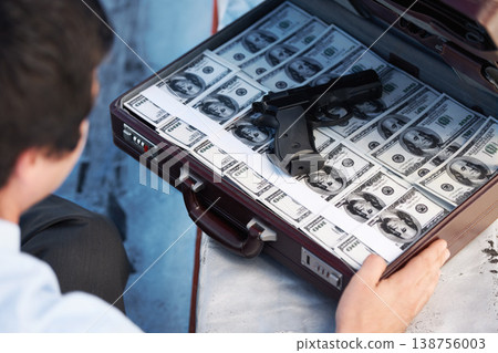 Businessman, gun and briefcase with money for crime, corruption, thief and fraud outdoor for financial crisis. Professional, man and weapon with cash, finance and secret for laundering, scam or loan Businessman, gun and briefcase with money for crime, corruption, thief and fraud outdoor for financial crisis. Professional, man and weapon with cash, finance and secret for laundering, scam or loan 138756003