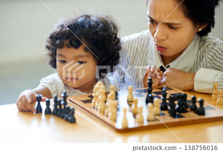 Mother, girl and chess play fun for learning growth, development challenge or bonding time. Child, woman or board game for problem solving intelligence or kids lesson, planning knowledge or education Mother, girl and chess play fun for learning growth, development challenge or bonding time. Child, woman or board game for problem solving intelligence or kids lesson, planning knowledge or education 138756016